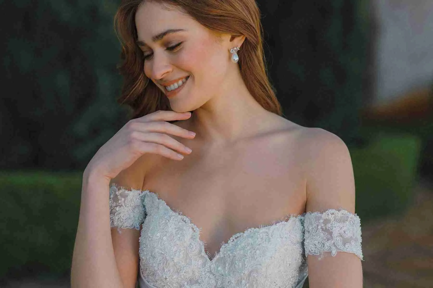 Allure Bridals A1479 wedding dress with a sweetheart off-the-shoulder lace neckline