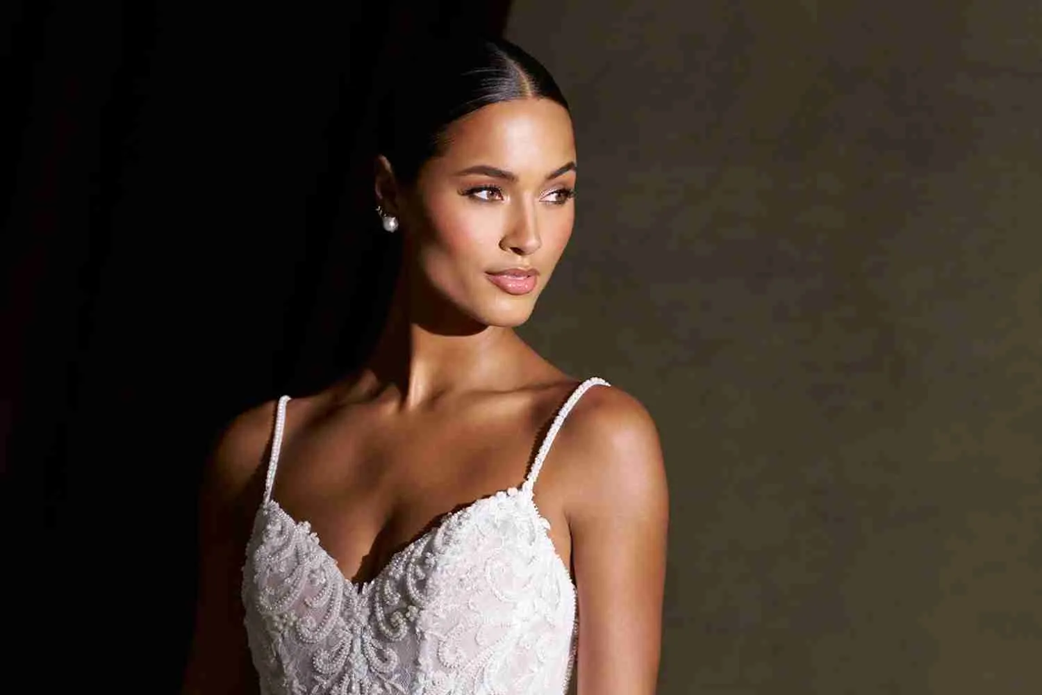 Allure Couture C848 wedding dress with a beaded Chantilly lace bodice and spaghetti straps